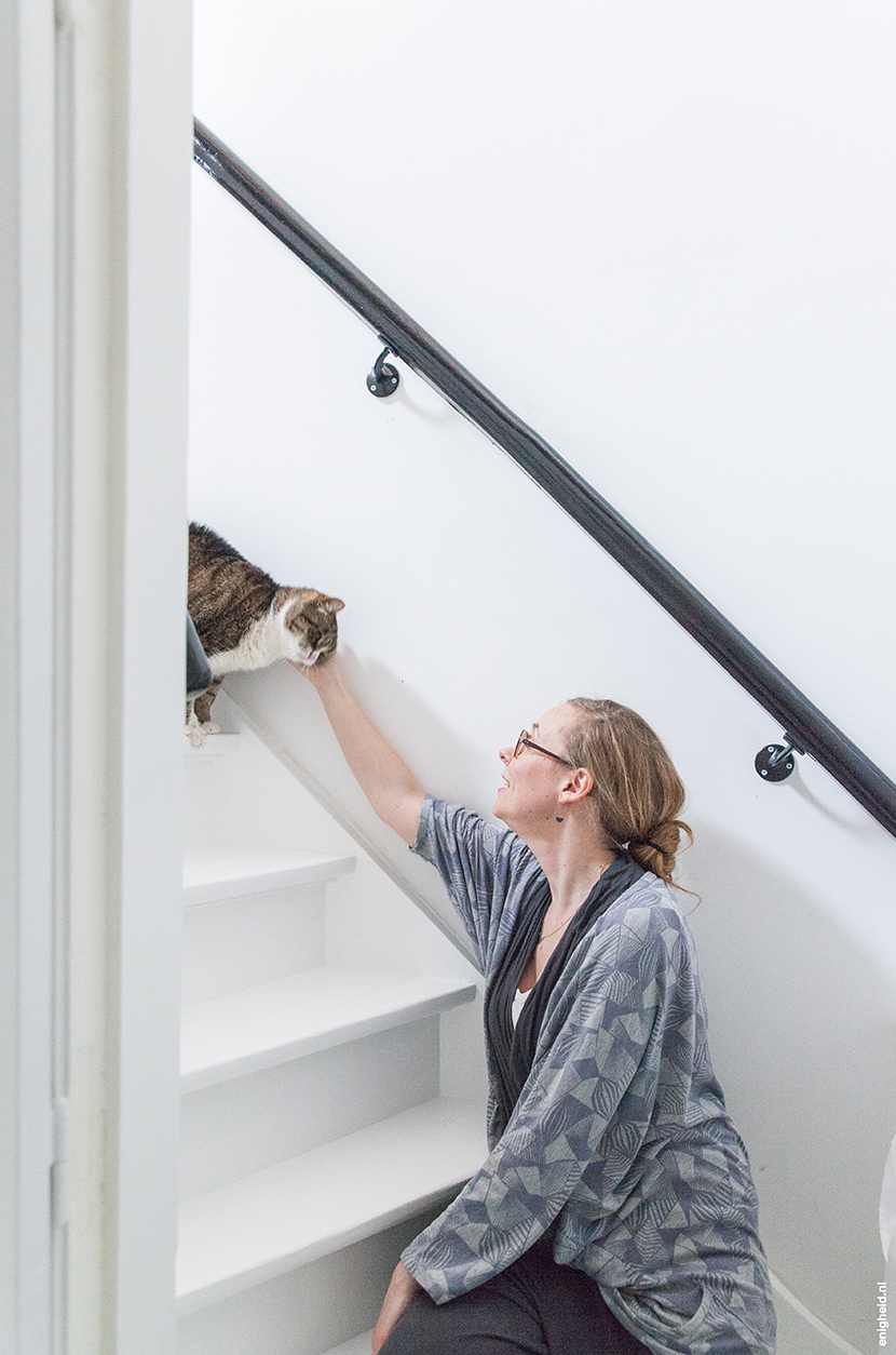 Hallway in the home of Iris Vank, with Aart Staartjes and Iris on the stairs | Enigheid