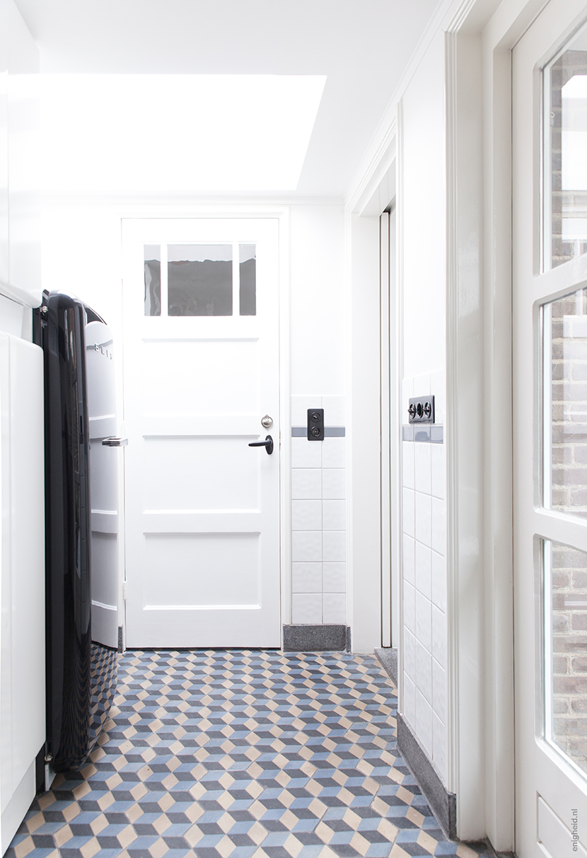Utility room in the home of Iris and Teun Vank in Den Bosch. Smeg freezer, antique vintage tiles. | blog by Enigheid